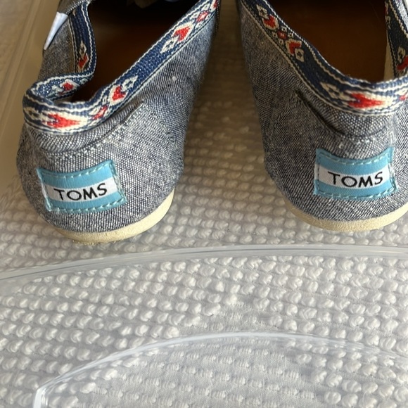 Toms denim look slip ons with navy blue and orange Aztec trim. Size 7 - Picture 5 of 8